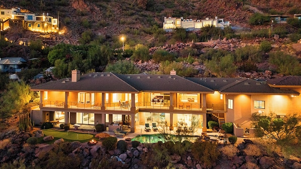 Camelback Heights estate set into Camelback Mountain at dusk